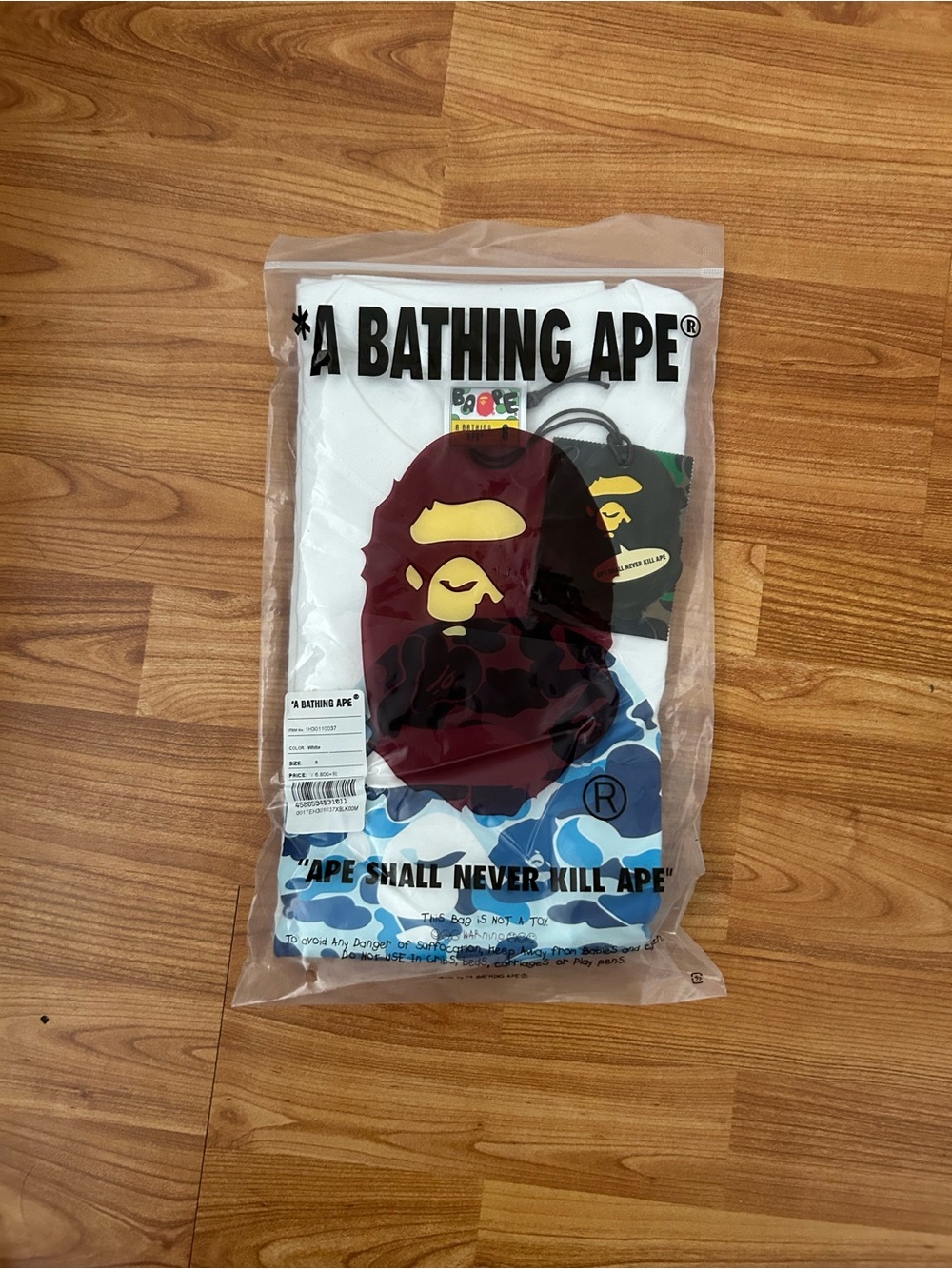 A Bathing Ape White Short-Sleeve Graphic Tee with Red Ape Motif